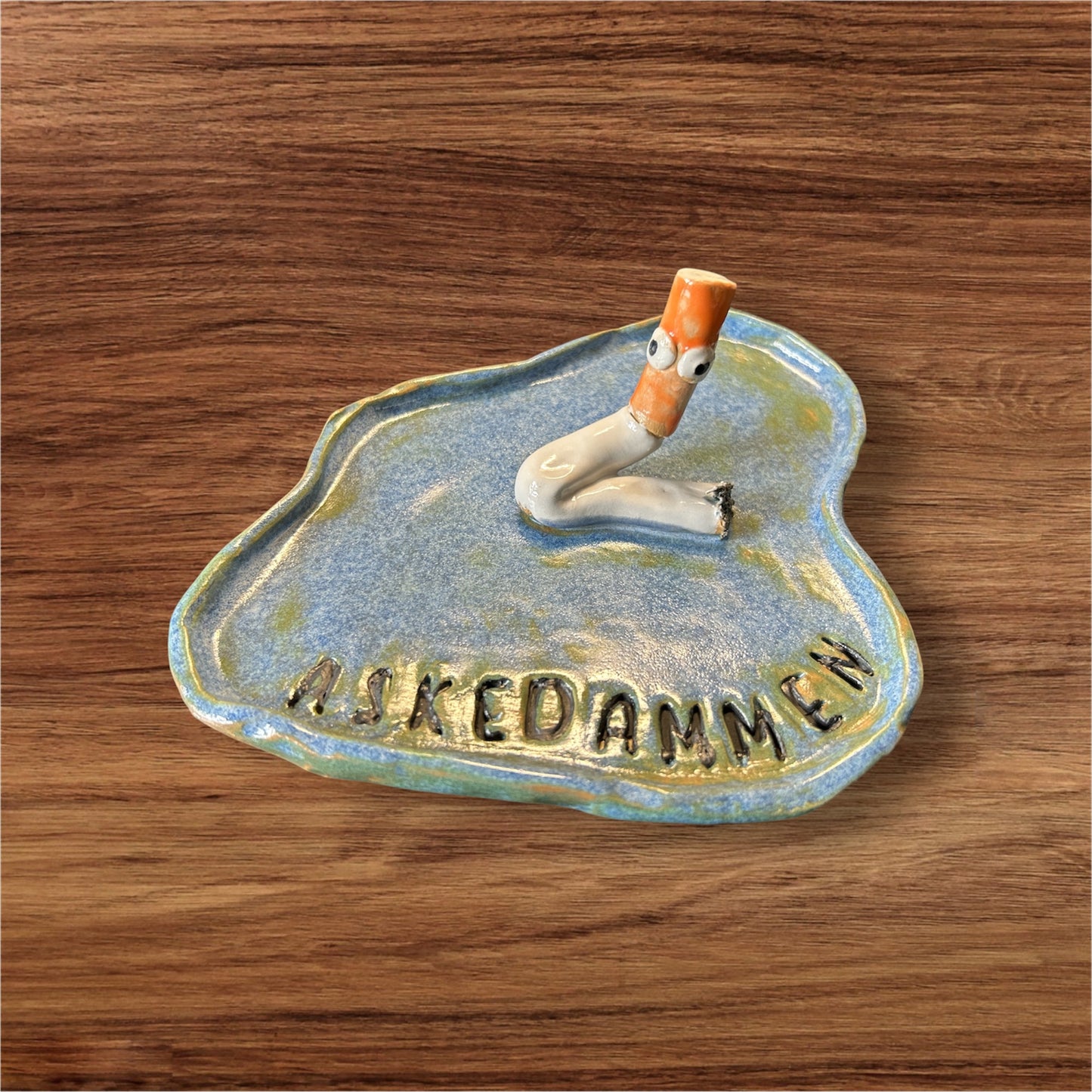 Askedammen